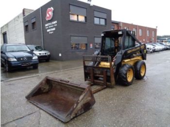 اللودر بعجل New Holland LX665: صورة 1
