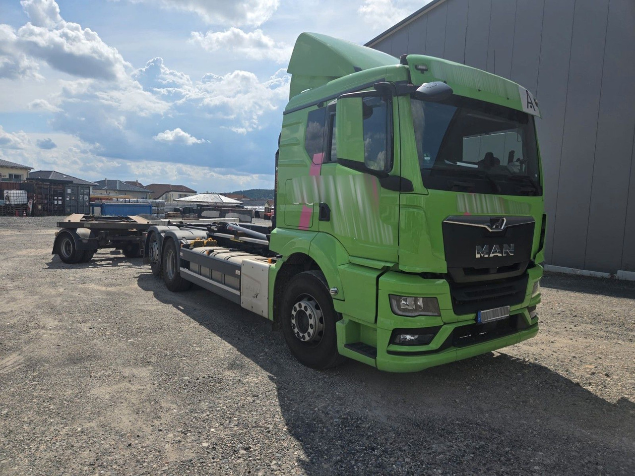 MAN TGS 26.510 Abrollkipper HIAB Lift -Lenkachse - شاحنة ذات خطاف: صورة 1 MAN TGS 26.510 Abrollkipper HIAB Lift -Lenkachse - شاحنة ذات خطاف: صورة 1