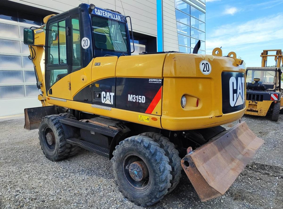 Caterpillar M315D - حفارة دولاب: صورة 1 Caterpillar M315D - حفارة دولاب: صورة 1