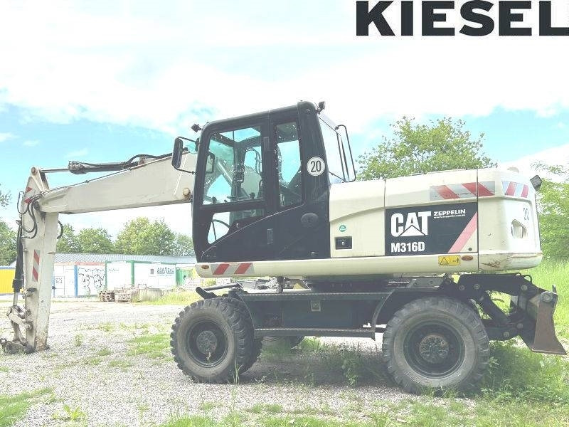 CAT M 316 D - حفارة دولاب: صورة 1 CAT M 316 D - حفارة دولاب: صورة 1
