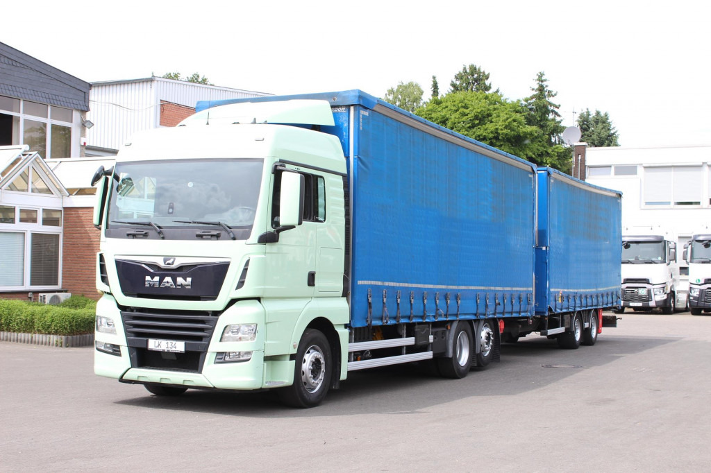 MAN TGX26.460 Durchlad Plane-Jumbo Retarder Hubdach - شاحنة ستارة: صورة 1 MAN TGX26.460 Durchlad Plane-Jumbo Retarder Hubdach - شاحنة ستارة: صورة 1