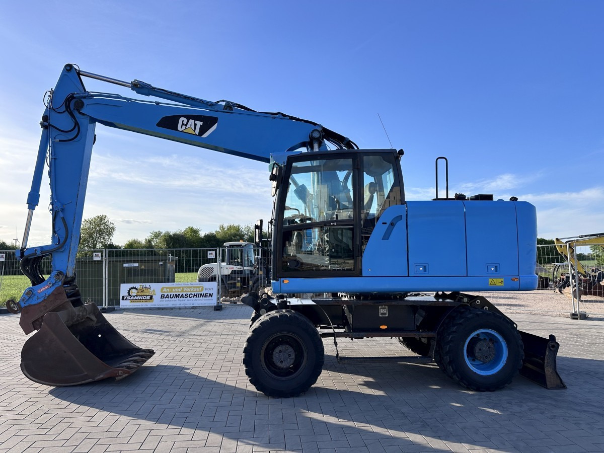 CATERPILLAR M 318 F Oil Quick OQ 65 Deutsche Maschine Top ! - حفارة دولاب: صورة 1 CATERPILLAR M 318 F Oil Quick OQ 65 Deutsche Maschine Top ! - حفارة دولاب: صورة 1
