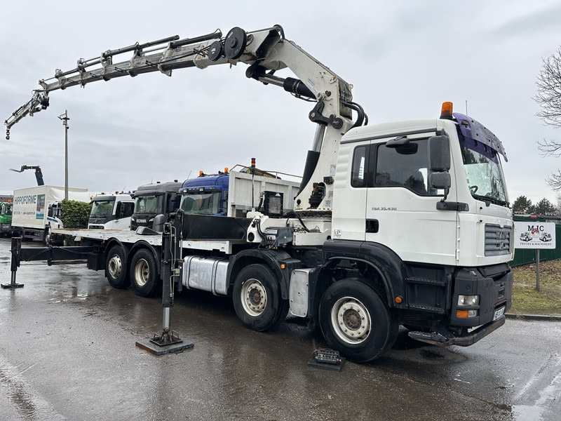 MAN TGA 35.430 8x2 + KRAN HIAB 700 E-6 + JIB 165X-3 - RETARDER - PRITSCHE 6m70~8m50 EXTENDABLE - MANUAL GEARBOX ZF - LIFT + STEERING AXLE - شاحنات مسطحة, شاحنة كرين: صورة 1 MAN TGA 35.430 8x2 + KRAN HIAB 700 E-6 + JIB 165X-3 - RETARDER - PRITSCHE 6m70~8m50 EXTENDABLE - MANUAL GEARBOX ZF - LIFT + STEERING AXLE - شاحنات مسطحة, شاحنة كرين: صورة 1