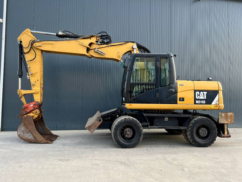 Cat M315D - حفارة دولاب: صورة 2 Cat M315D - حفارة دولاب: صورة 2