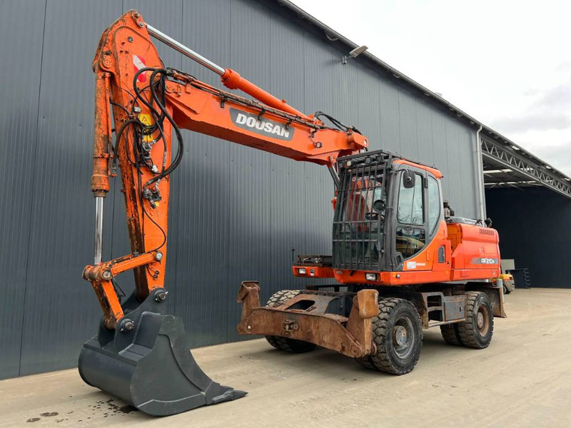 Doosan DX210W - حفارة دولاب: صورة 1 Doosan DX210W - حفارة دولاب: صورة 1