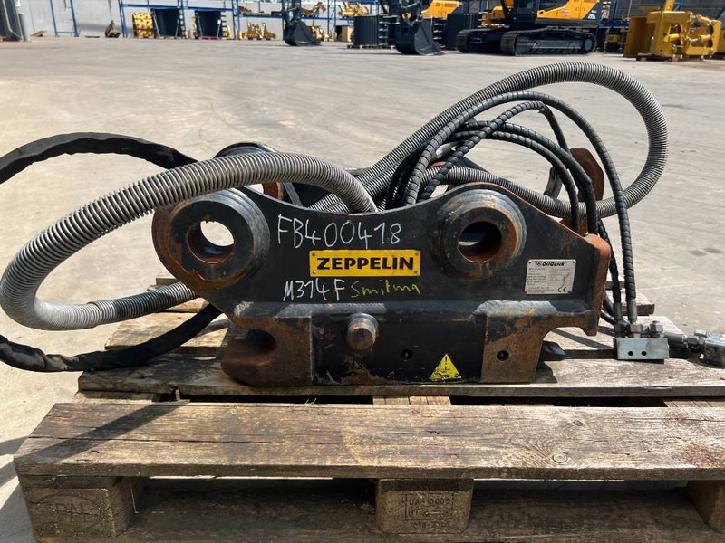 OilQuick OQ65 - M314F / M316F / M318F - قارنة توصيل هيدروليكي - آلات البناء: صورة 4 OilQuick OQ65 - M314F / M316F / M318F - قارنة توصيل هيدروليكي - آلات البناء: صورة 4