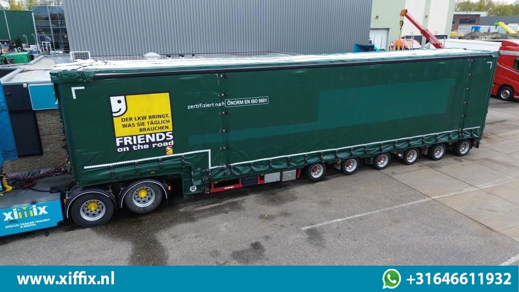 Meusburger 6-ass. Semi dieplader met elektische huifopbouw / 3x naloop gestuurd - عربة منخفضة مسطحة نصف مقطورة: صورة 1 Meusburger 6-ass. Semi dieplader met elektische huifopbouw / 3x naloop gestuurd - عربة منخفضة مسطحة نصف مقطورة: صورة 1