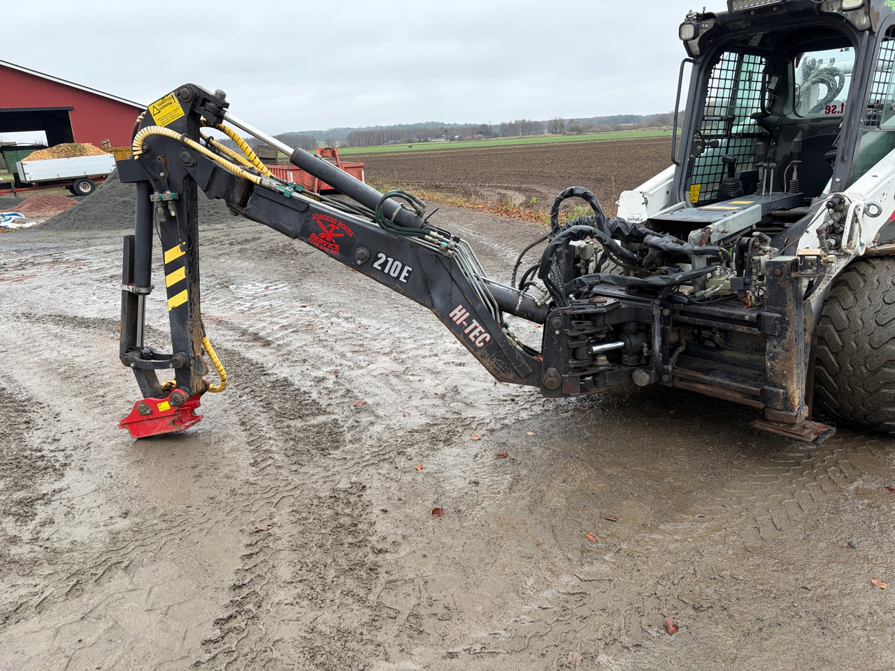 Bobcat HI-Tec 210E - معدات البناء: صورة 1 Bobcat HI-Tec 210E - معدات البناء: صورة 1