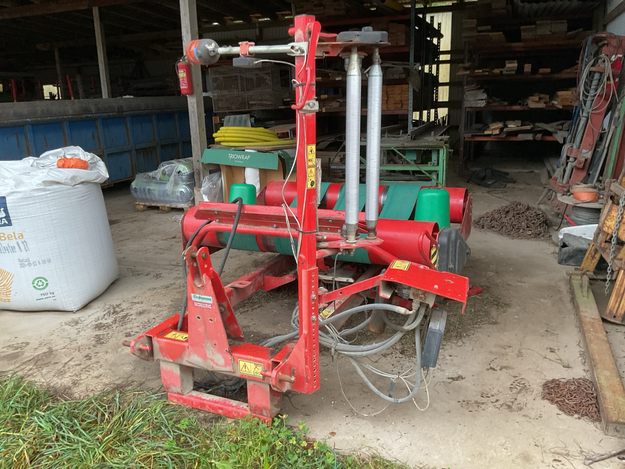 Kverneland 7558 - آلة تغليف بالة التبن: صورة 1 Kverneland 7558 - آلة تغليف بالة التبن: صورة 1