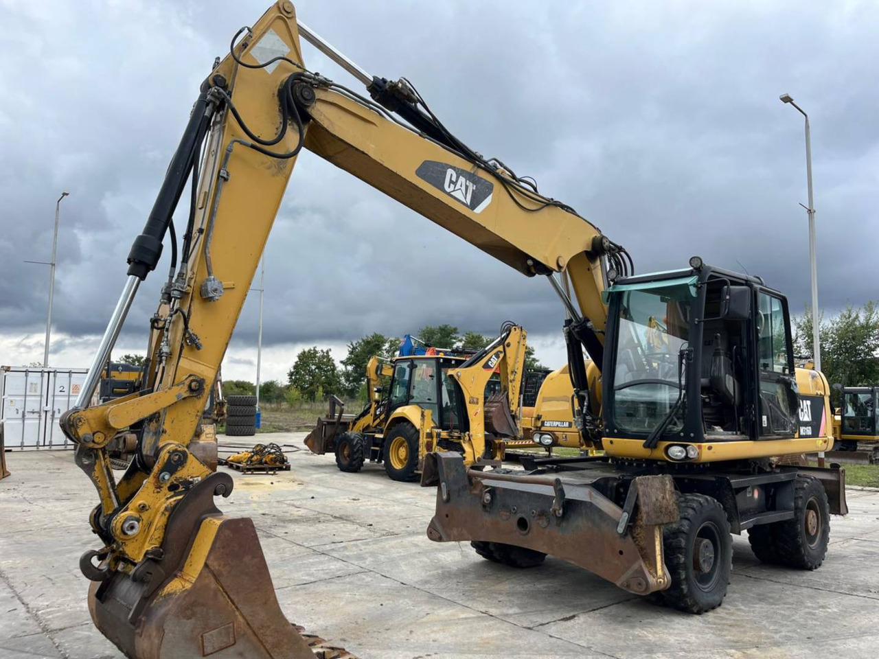 CAT M316D - حفارة دولاب: صورة 1 CAT M316D - حفارة دولاب: صورة 1