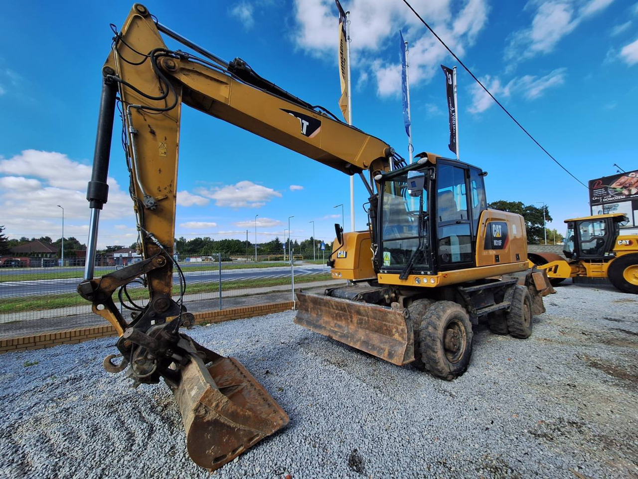 CAT M318F - حفارة دولاب: صورة 1 CAT M318F - حفارة دولاب: صورة 1