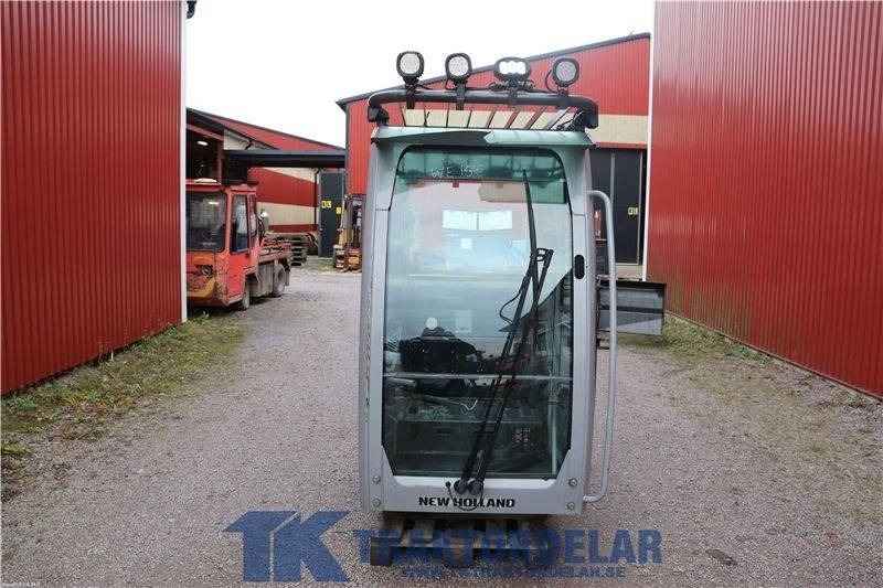 New Holland WE150C - كابينة - الآلات الزراعية: صورة 1 New Holland WE150C - كابينة - الآلات الزراعية: صورة 1