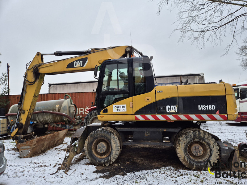 Caterpillar M 318 D - حفارة دولاب: صورة 1 Caterpillar M 318 D - حفارة دولاب: صورة 1