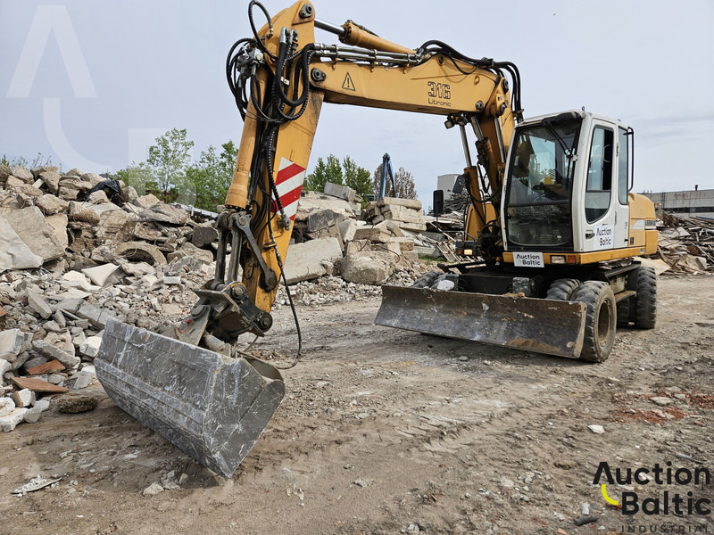 Liebherr A 316 Litronic - حفارة دولاب: صورة 1 Liebherr A 316 Litronic - حفارة دولاب: صورة 1
