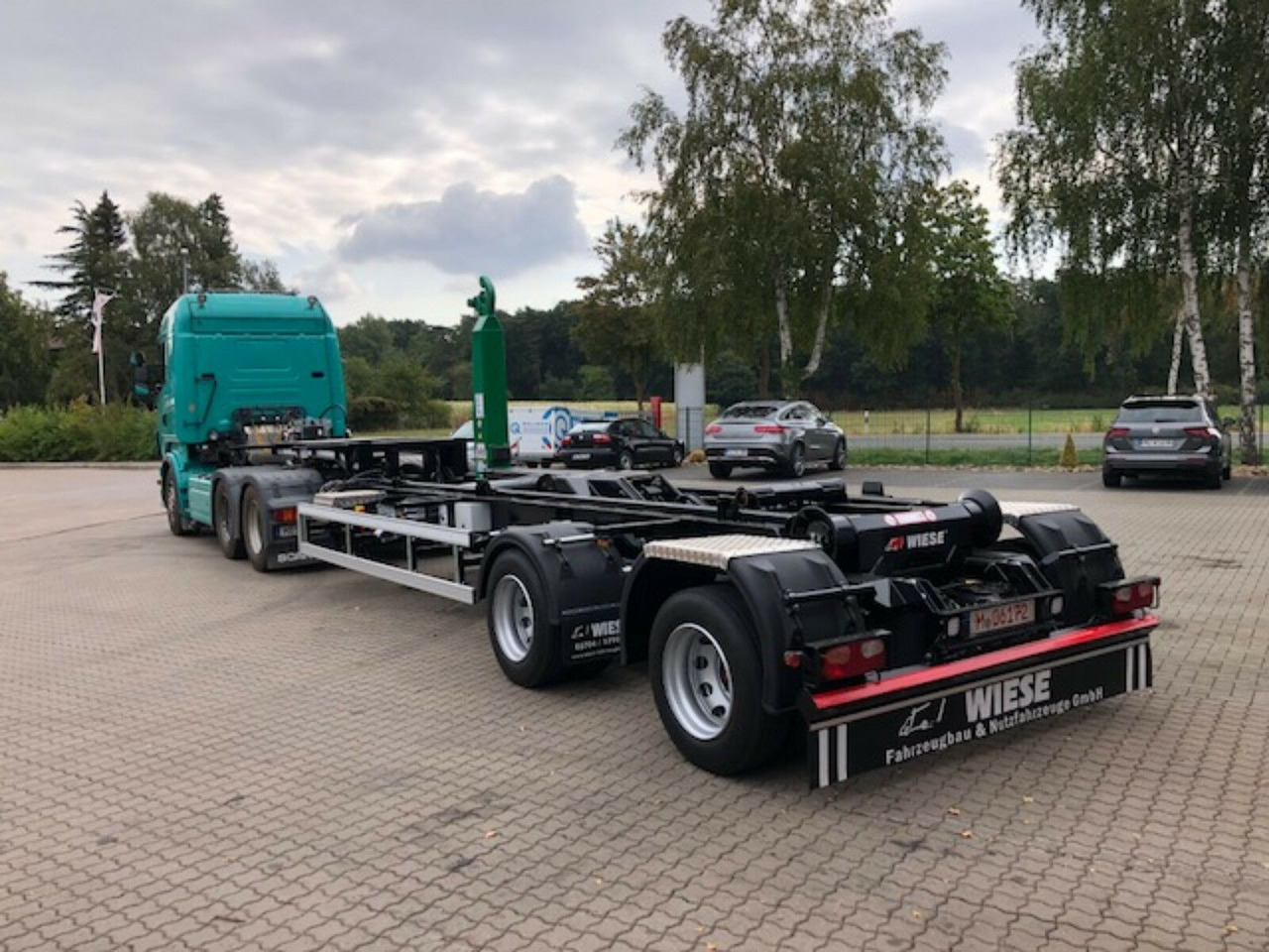 Auflieger Abrollkipper Hakenlift Hooklift - نصف مقطورة لنقل الحاويات: صورة 1 Auflieger Abrollkipper Hakenlift Hooklift - نصف مقطورة لنقل الحاويات: صورة 1