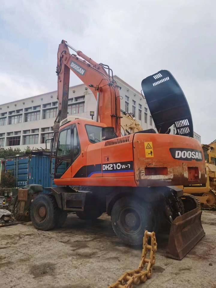 DOOSAN DH210W-7 - حفارة دولاب: صورة 1 DOOSAN DH210W-7 - حفارة دولاب: صورة 1