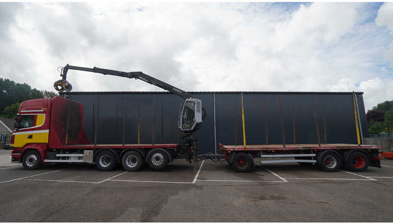 Scania R 580 V8 8X4 LOGTRANSPORT COMBI WITH MTDK YEAR 2012 TRAILER KESLA 46 CRANE - شاحنة قطع الأشجار, شاحنة كرين: صورة 1 Scania R 580 V8 8X4 LOGTRANSPORT COMBI WITH MTDK YEAR 2012 TRAILER KESLA 46 CRANE - شاحنة قطع الأشجار, شاحنة كرين: صورة 1