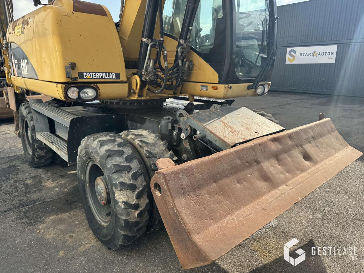 حفارة دولاب Caterpillar M313D: صورة 7