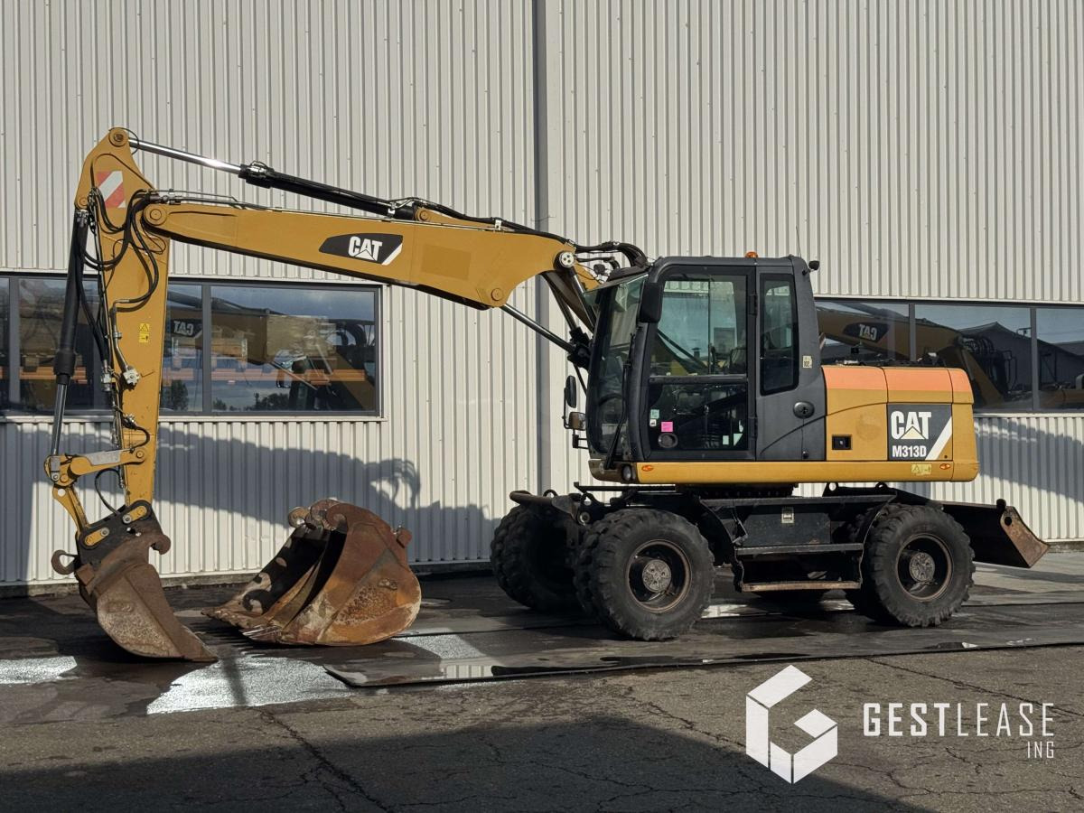 Caterpillar M313D - حفارة دولاب: صورة 1 Caterpillar M313D - حفارة دولاب: صورة 1