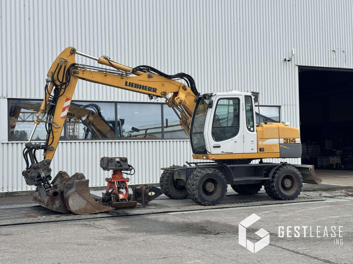 Liebherr A314 Litronic - حفارة دولاب: صورة 1 Liebherr A314 Litronic - حفارة دولاب: صورة 1