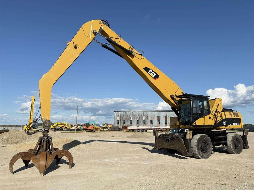 CAT M 325 DLMH - حفارة دولاب: صورة 1 CAT M 325 DLMH - حفارة دولاب: صورة 1