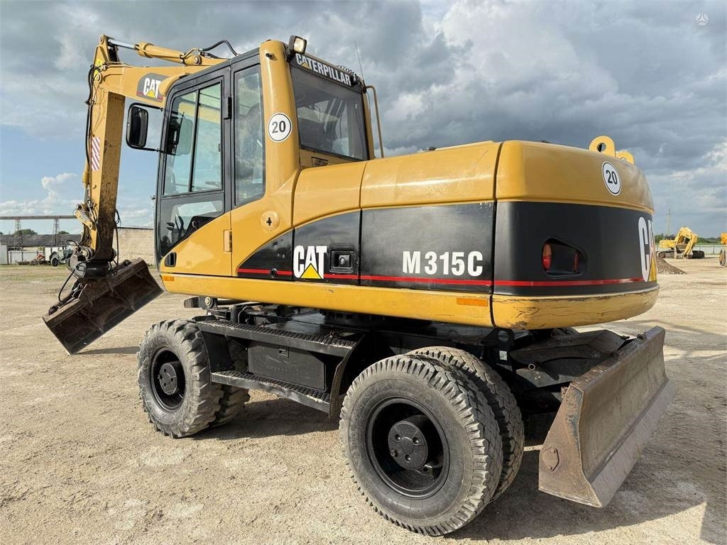 CAT M315C - حفارة دولاب: صورة 1 CAT M315C - حفارة دولاب: صورة 1