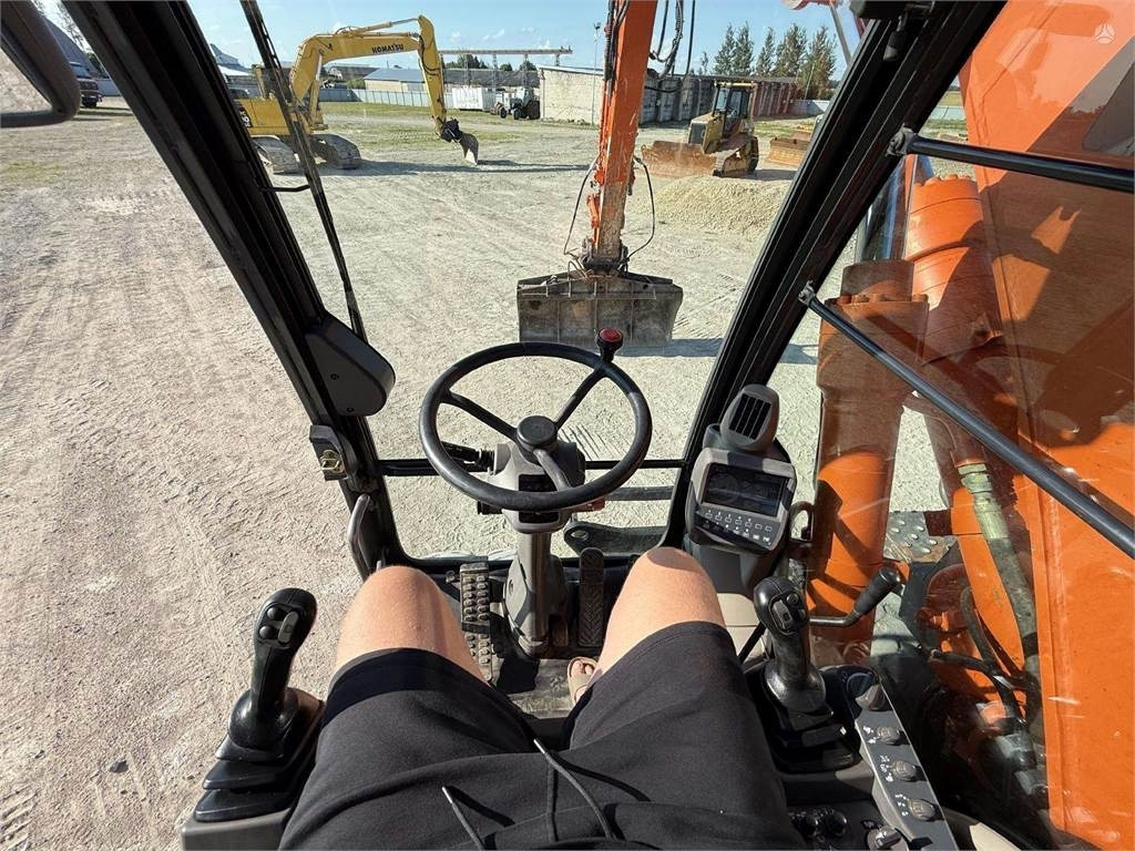 حفارة دولاب Hitachi ZX 140 W: صورة 12