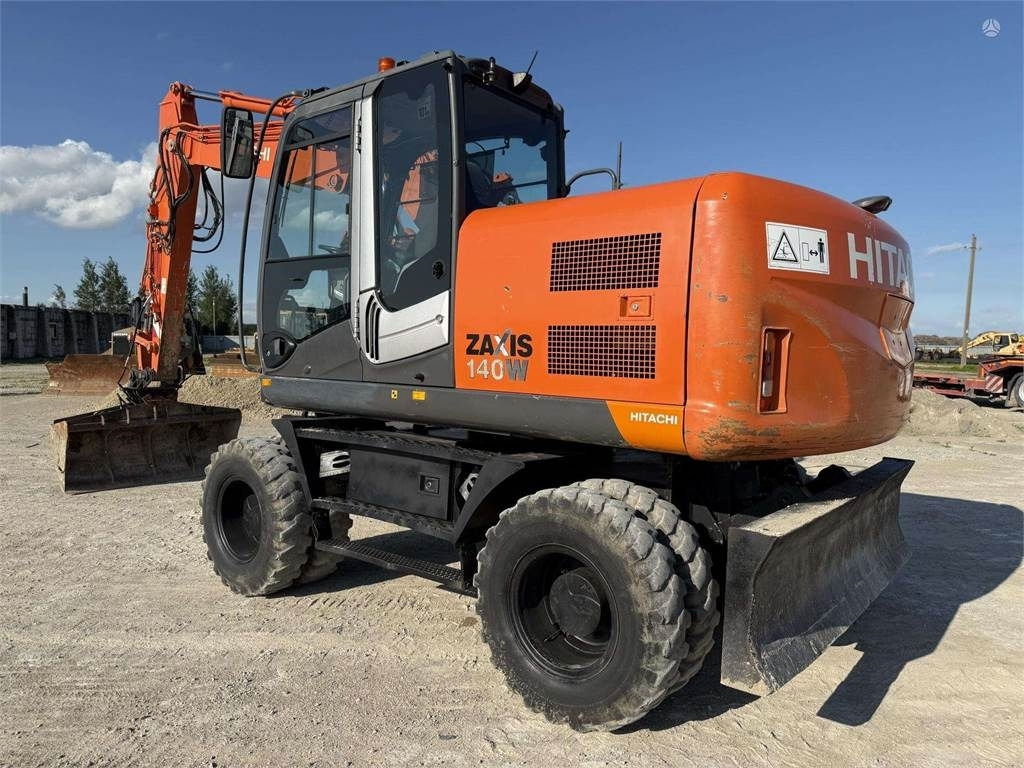 Hitachi ZX 140 W - حفارة دولاب: صورة 1 Hitachi ZX 140 W - حفارة دولاب: صورة 1