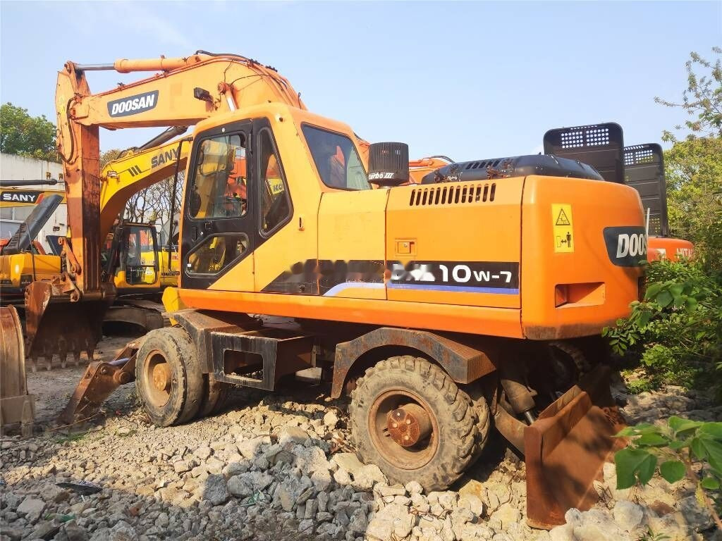 Doosan DH 210 W-7 - حفارة دولاب: صورة 1 Doosan DH 210 W-7 - حفارة دولاب: صورة 1