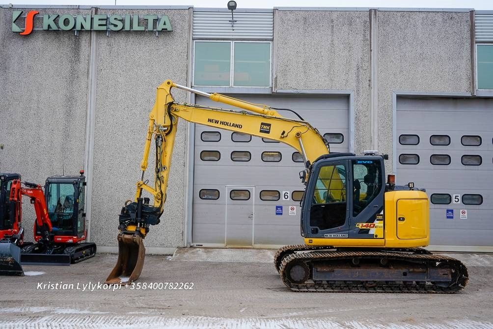 New Holland E140CSR PYÖRITTÄJÄLLÄ - حفار زحاف: صورة 1 New Holland E140CSR PYÖRITTÄJÄLLÄ - حفار زحاف: صورة 1