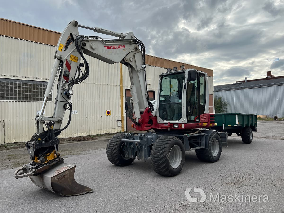 Hjulgrävare Takeuchi TB295W med vagn & redskap - حفار زحاف: صورة 1 Hjulgrävare Takeuchi TB295W med vagn & redskap - حفار زحاف: صورة 1