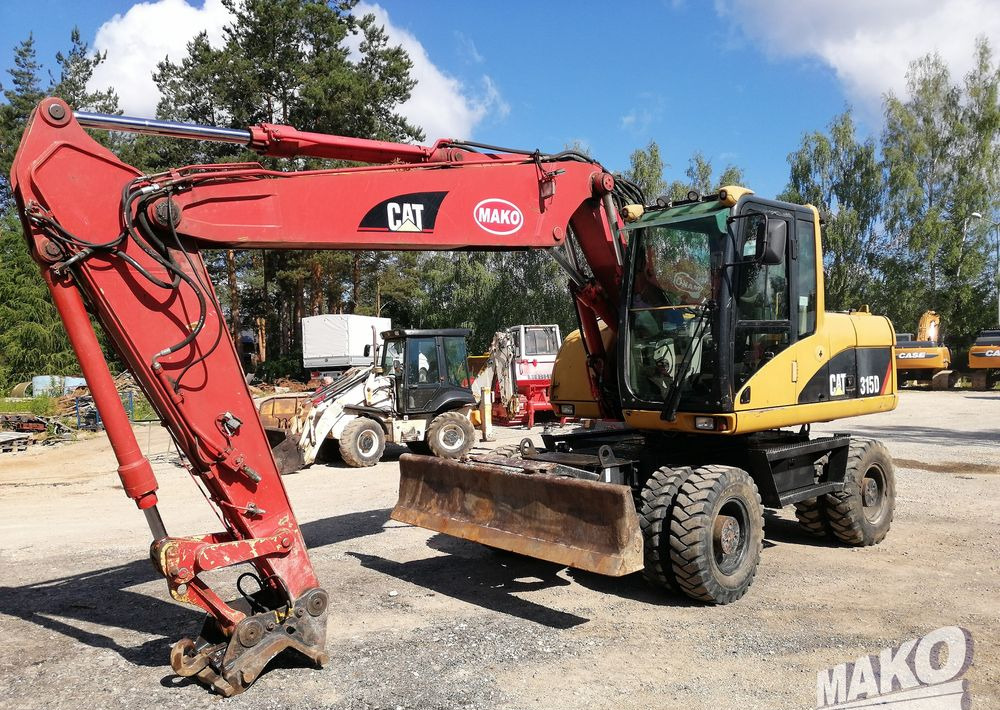 Caterpillar M315 C - حفارة دولاب: صورة 1 Caterpillar M315 C - حفارة دولاب: صورة 1