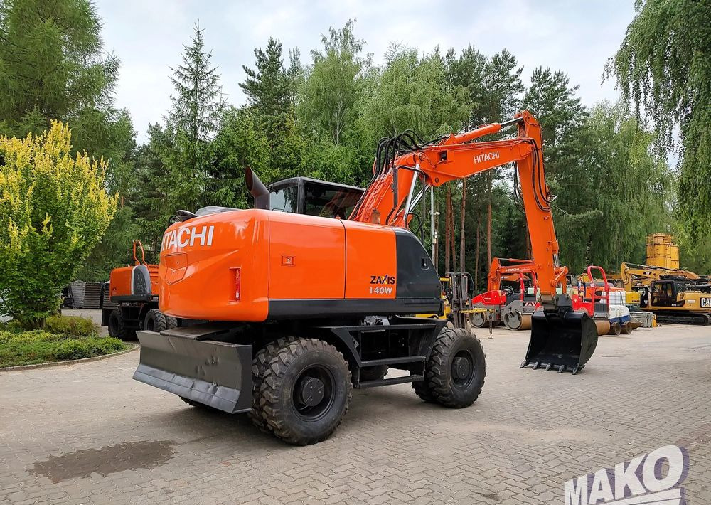 Hitachi ZX 140 - حفارة دولاب: صورة 4 Hitachi ZX 140 - حفارة دولاب: صورة 4