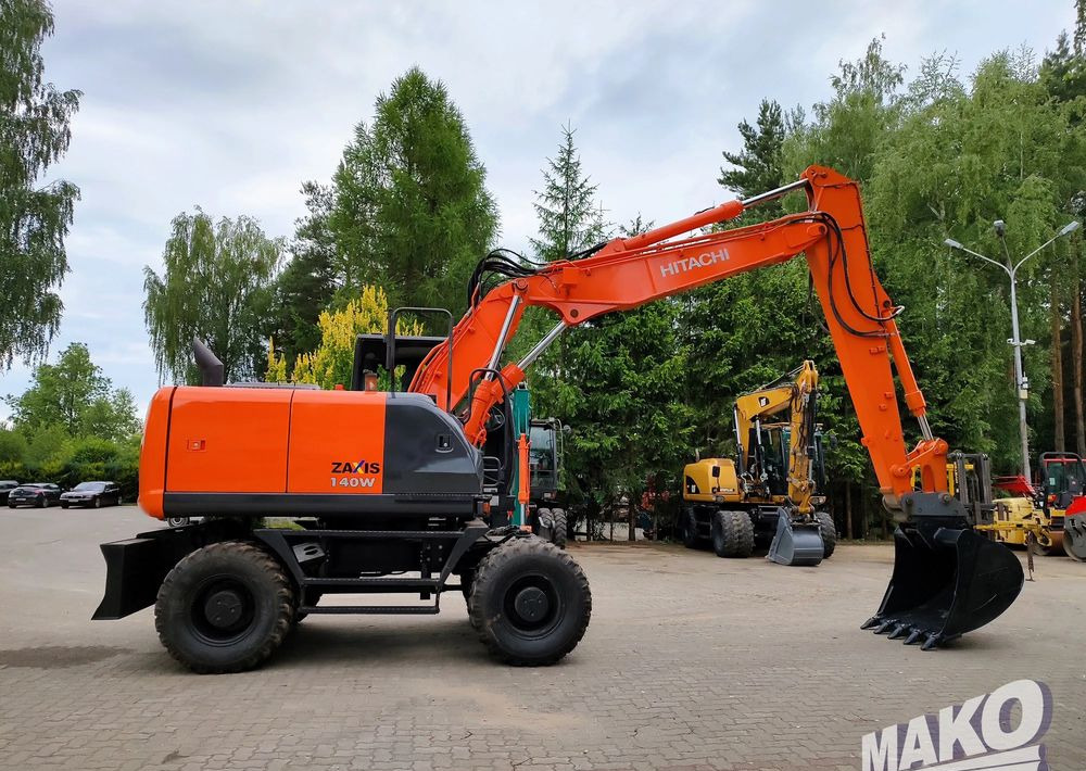 Hitachi ZX 140 - حفارة دولاب: صورة 5 Hitachi ZX 140 - حفارة دولاب: صورة 5