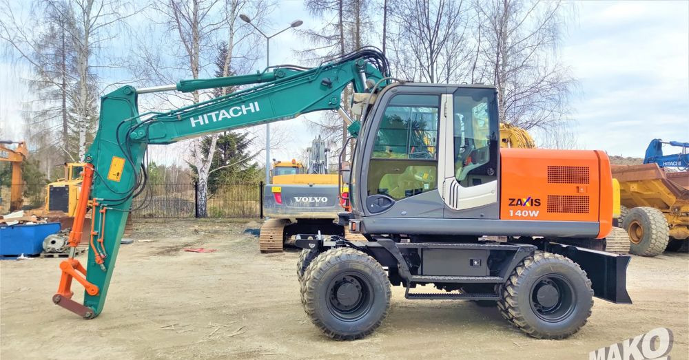 Hitachi ZX140W-3 - حفارة دولاب: صورة 1 Hitachi ZX140W-3 - حفارة دولاب: صورة 1