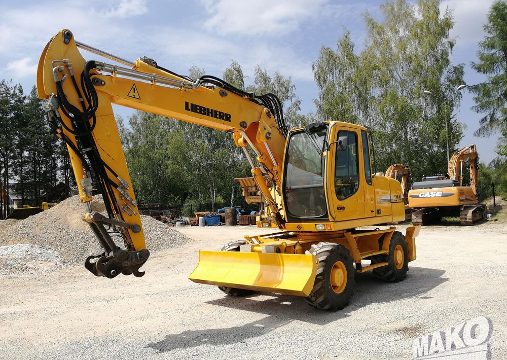 Liebherr A 314 Litronic - حفارة دولاب: صورة 1 Liebherr A 314 Litronic - حفارة دولاب: صورة 1