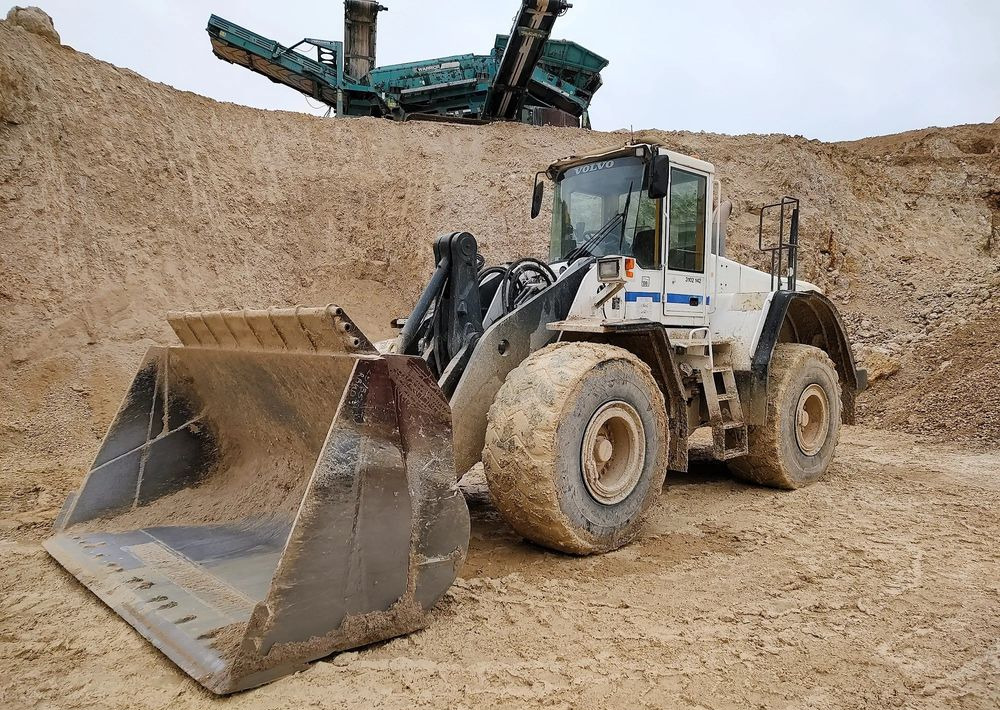 Volvo L180E - اللودر بعجل: صورة 1 Volvo L180E - اللودر بعجل: صورة 1