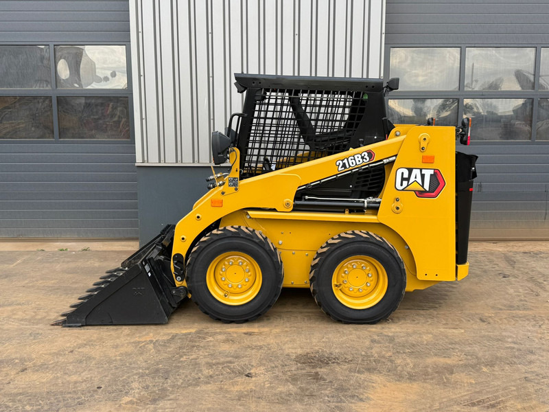 Caterpillar 216B3 - اللودر بعجل: صورة 1 Caterpillar 216B3 - اللودر بعجل: صورة 1