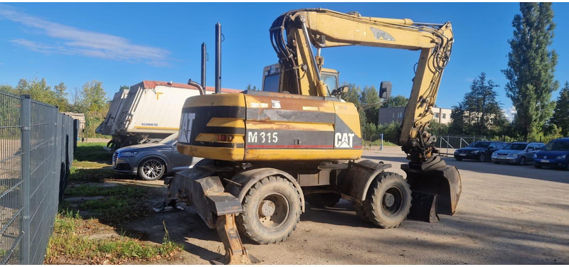 Caterpillar M 315 Rototilt - حفارة دولاب: صورة 2 Caterpillar M 315 Rototilt - حفارة دولاب: صورة 2