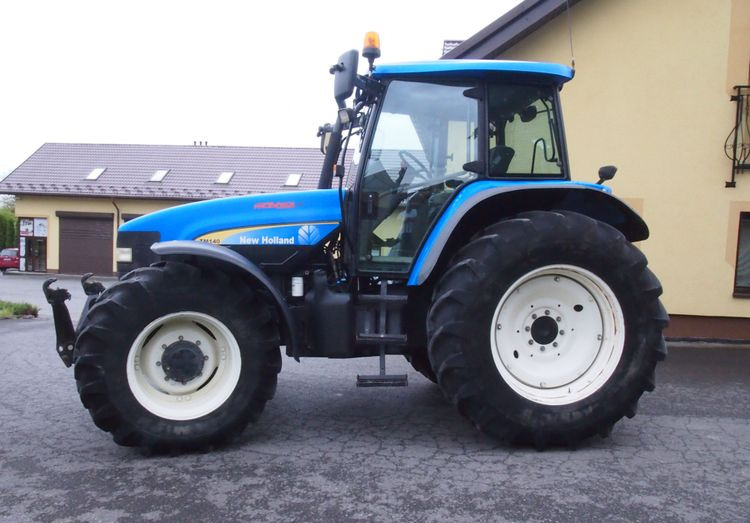 Ciągnik New Holland TM 140 2004 Przedni TUZ - جرار: صورة 5 Ciągnik New Holland TM 140 2004 Przedni TUZ - جرار: صورة 5