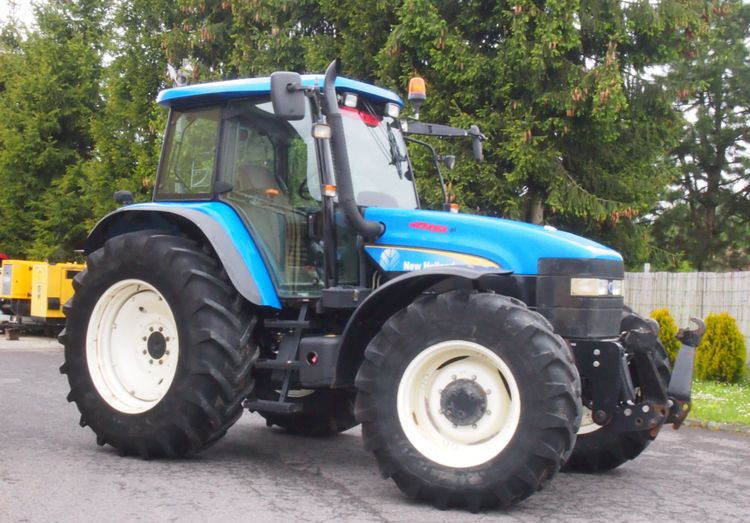 Ciągnik New Holland TM 140 2004 Przedni TUZ - جرار: صورة 1 Ciągnik New Holland TM 140 2004 Przedni TUZ - جرار: صورة 1