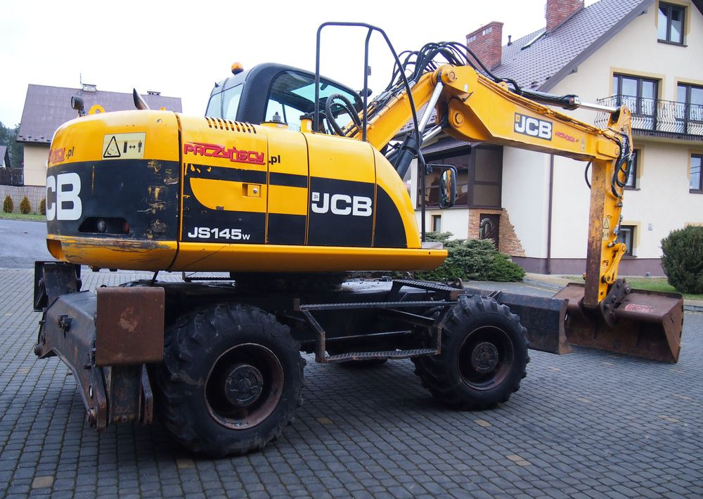 Koparka kołowa JCB JS145W 2011 Koparka JCB - حفارة دولاب: صورة 2 Koparka kołowa JCB JS145W 2011 Koparka JCB - حفارة دولاب: صورة 2