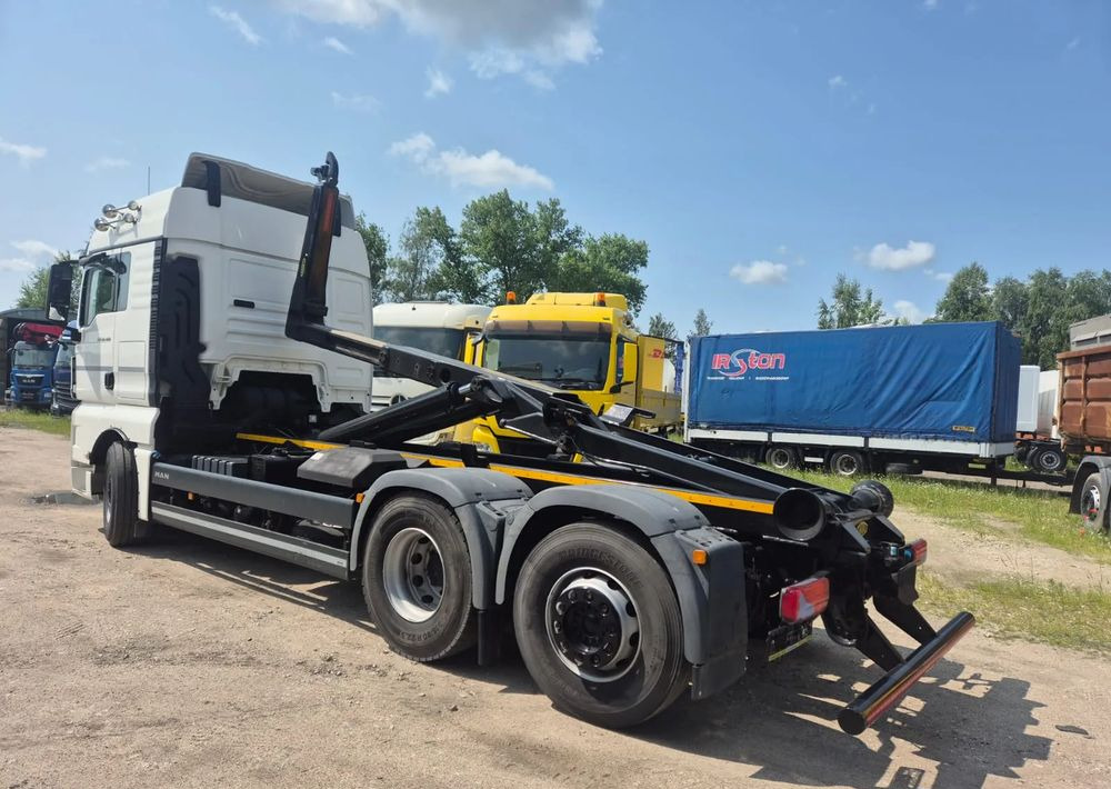 MAN TGX 26-460 Hakowiec oś skrętna - شاحنة ذات خطاف: صورة 1 MAN TGX 26-460 Hakowiec oś skrętna - شاحنة ذات خطاف: صورة 1