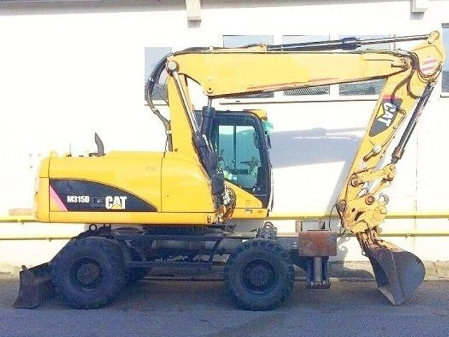 Caterpillar M 315 D - حفارة دولاب: صورة 1 Caterpillar M 315 D - حفارة دولاب: صورة 1