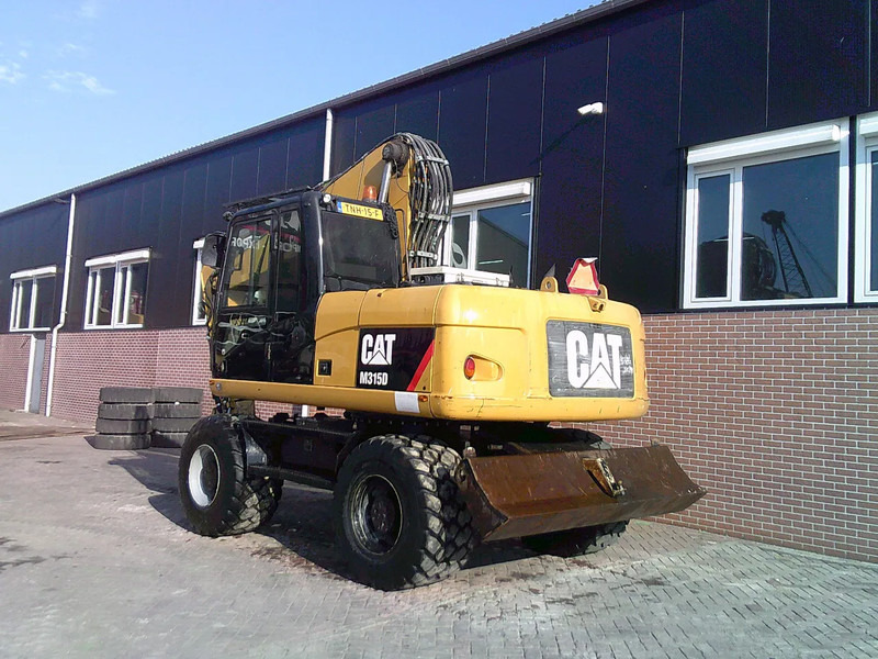Caterpillar M315D - حفارة دولاب: صورة 2 Caterpillar M315D - حفارة دولاب: صورة 2