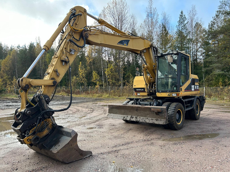 Caterpillar M312 Engcon EC20 tiltrotator - حفارة دولاب: صورة 1 Caterpillar M312 Engcon EC20 tiltrotator - حفارة دولاب: صورة 1