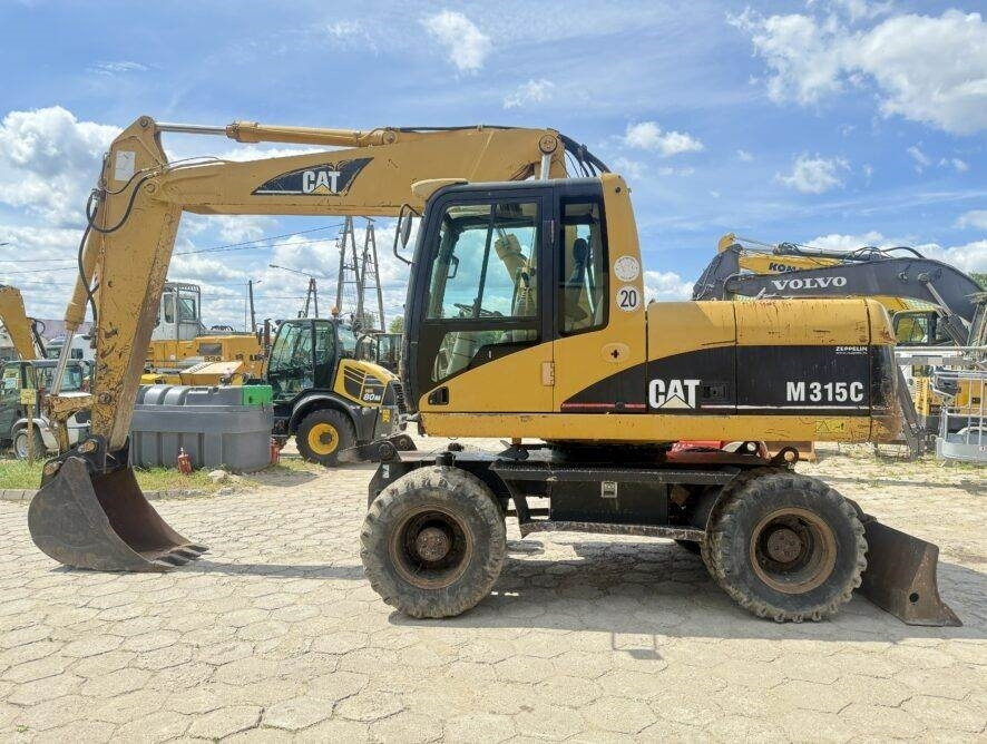 CAT M315C AC - حفارة دولاب: صورة 1 CAT M315C AC - حفارة دولاب: صورة 1