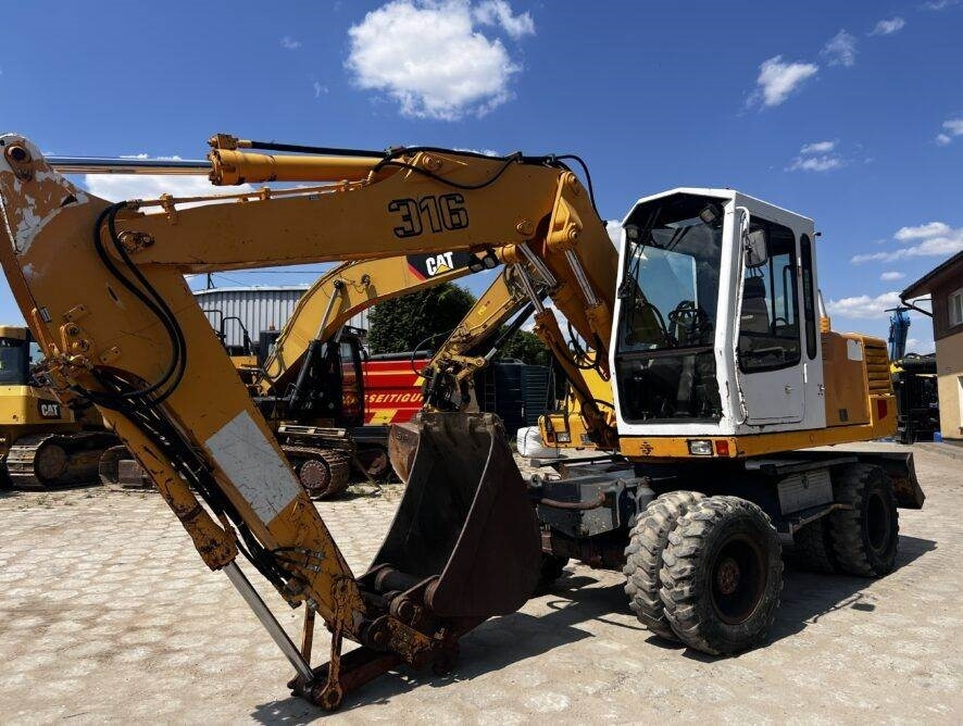 Liebherr A316 - حفارة دولاب: صورة 1 Liebherr A316 - حفارة دولاب: صورة 1