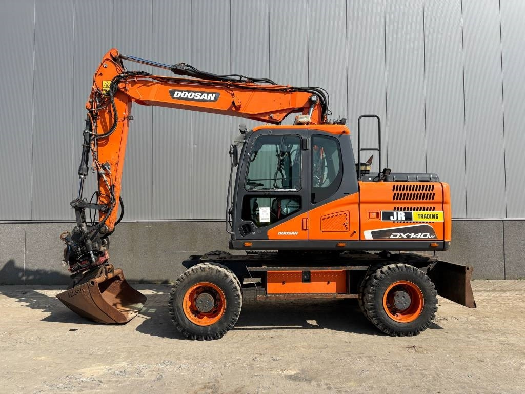 Doosan DX 140 W-5 (R5 Rototilt) - حفارة دولاب: صورة 1 Doosan DX 140 W-5 (R5 Rototilt) - حفارة دولاب: صورة 1