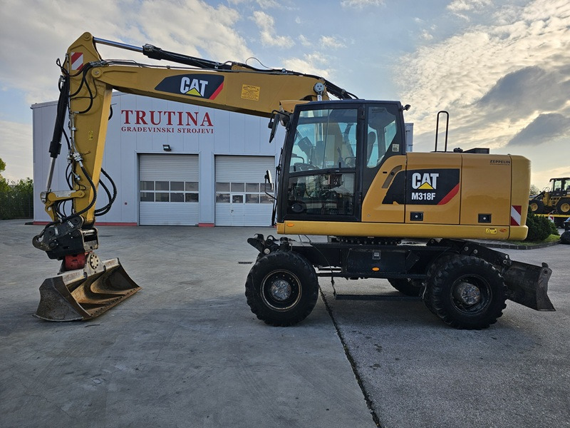 CATERPILLAR M318F - حفارة دولاب: صورة 1 CATERPILLAR M318F - حفارة دولاب: صورة 1